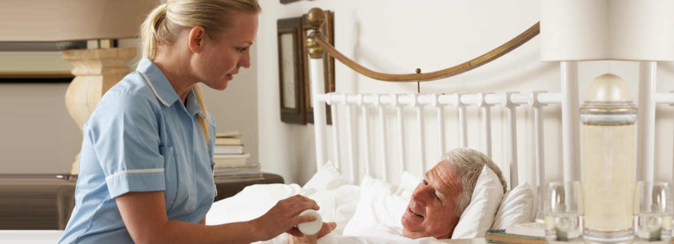 caregiver giving medication